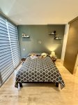 La Isla Bonita`s bedroom with queen bed, desk, balcony and bath
